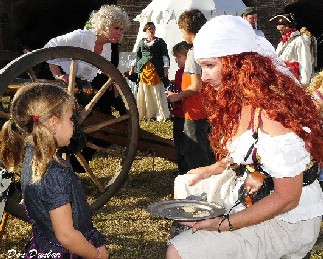 Sandi Feeding a Kid Hard Tack