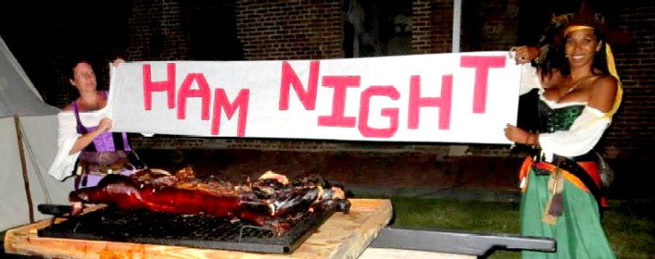 Stephanie and Pearl Hold the Ham Night Sign