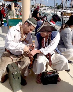 Edward and Dutch Priming a Gun