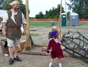 Kid watching Billie fix the gibbet