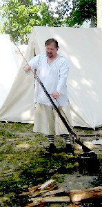 Dan Needham cleaning his gun