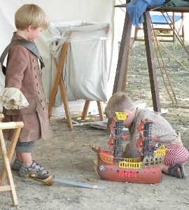 Pirate boys playing with pirate toys