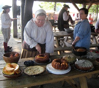 Woman cutting a cake for pitch in dinner