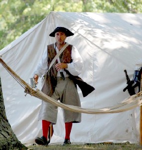 Silas Thatcher in front of the Thatcher's Tent
