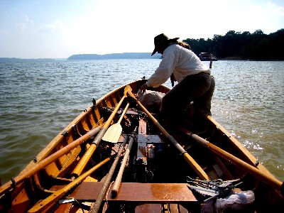 Michael Bagley half in the Firefly and half in the water