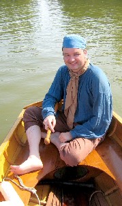 Mission sitting in the prow of the boat