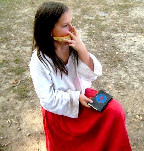 Grace with her new notebook and a slice of melon