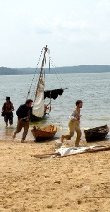 People running from ships during battle