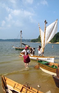 Suzanne watches while Michael & mark prepare the sail