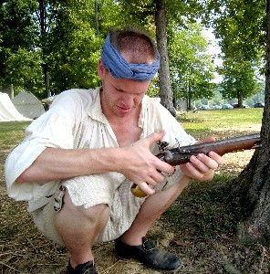 Sam playing with a musket