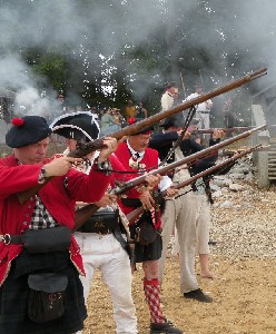 Defenders fire their muskets