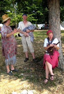 Mike D. and Sam S. yack while Suzanne cleans her pistol