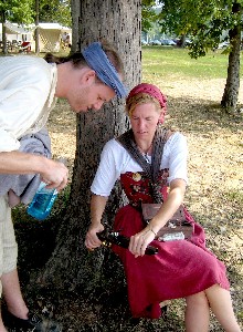 Sam examines Suzanne's gun