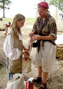 Suzanne prepares bloody bandages for Kat