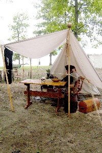 A fly under which is a guy with a skull