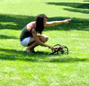 Girl with mini-cannon pointing in the distance