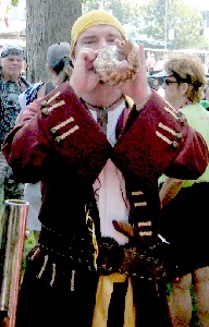 The noisy guy blowing his conch shell