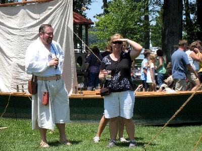 Daniel standing with a woman looking for something