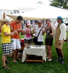 The group posing with the surgical instruments