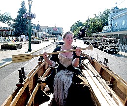 Kate rowing down the street