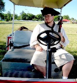 George driving the golf cart