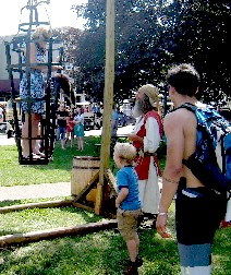 A boy throwing a skunk at his mom