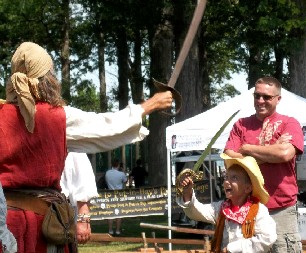 Billie swordfighting with a cowboy