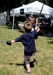 Kids swordfight and kick