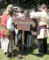 Trish being put into the stocks