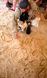 Thomas drawing in sand