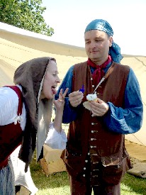 Mission watches Lisa lick the cupcake