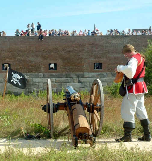 Harry firing the cannon at the tourists on the fort wall