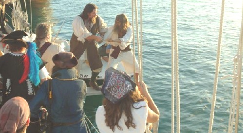 M.A. d'Dogge and Billy swordfight on the plank