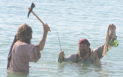 Bill and M.A. d'Dogge fight over rum in the ocean