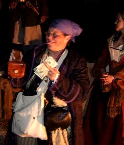 Momma Ratsey pays for her purchase at the auction