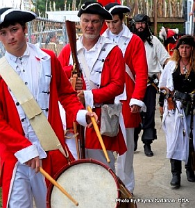 The defeated British are led into the fort.