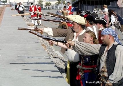The defenders of the fort aim and fire