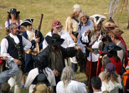 The pirates gather 'round the deposed Viceroy and Iron Nigel