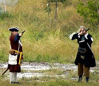 Michael and Captain Sterling firing their muskets at the fort