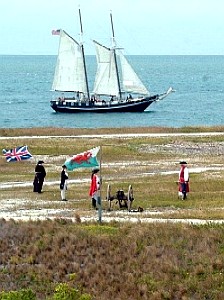 The Schooner Wolf sailing by the battle