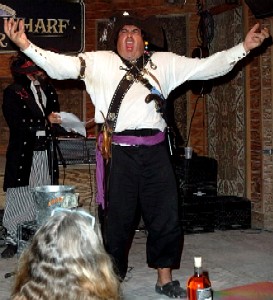 Men with arms out yelling at crowd