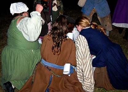 A group of women ostensibly delivering a baby