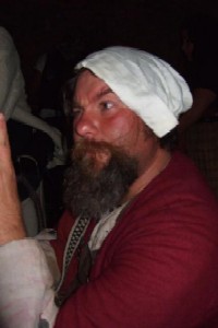 M.A. d'Dogge in a woman's hat