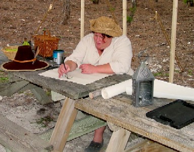 Silkie painting the Hide sign