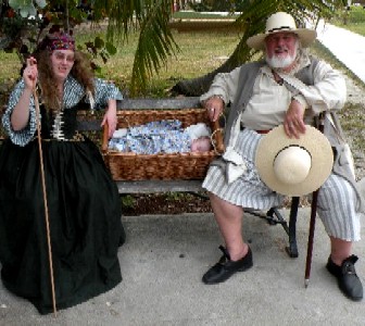 Salty and Callenish gunner on a park bench with Hamish 
        their baby
