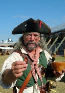 Captain Jim holding something out from the food bowl