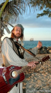 Greg and his guitar hitchhiking