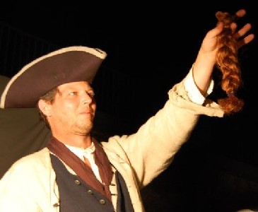 Edward holds his trophy - Lily's cut off braid