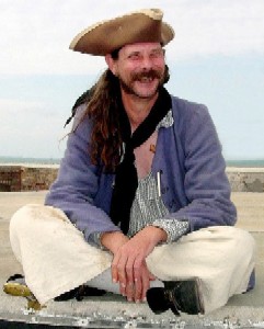 Patrick Hand sitting on the fort wall.
