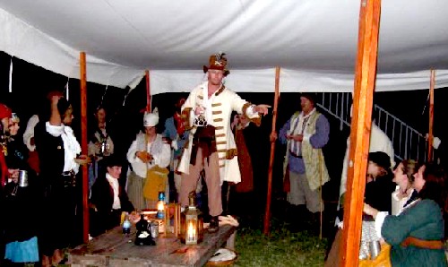 Cannibal Chrispy conducts the auction